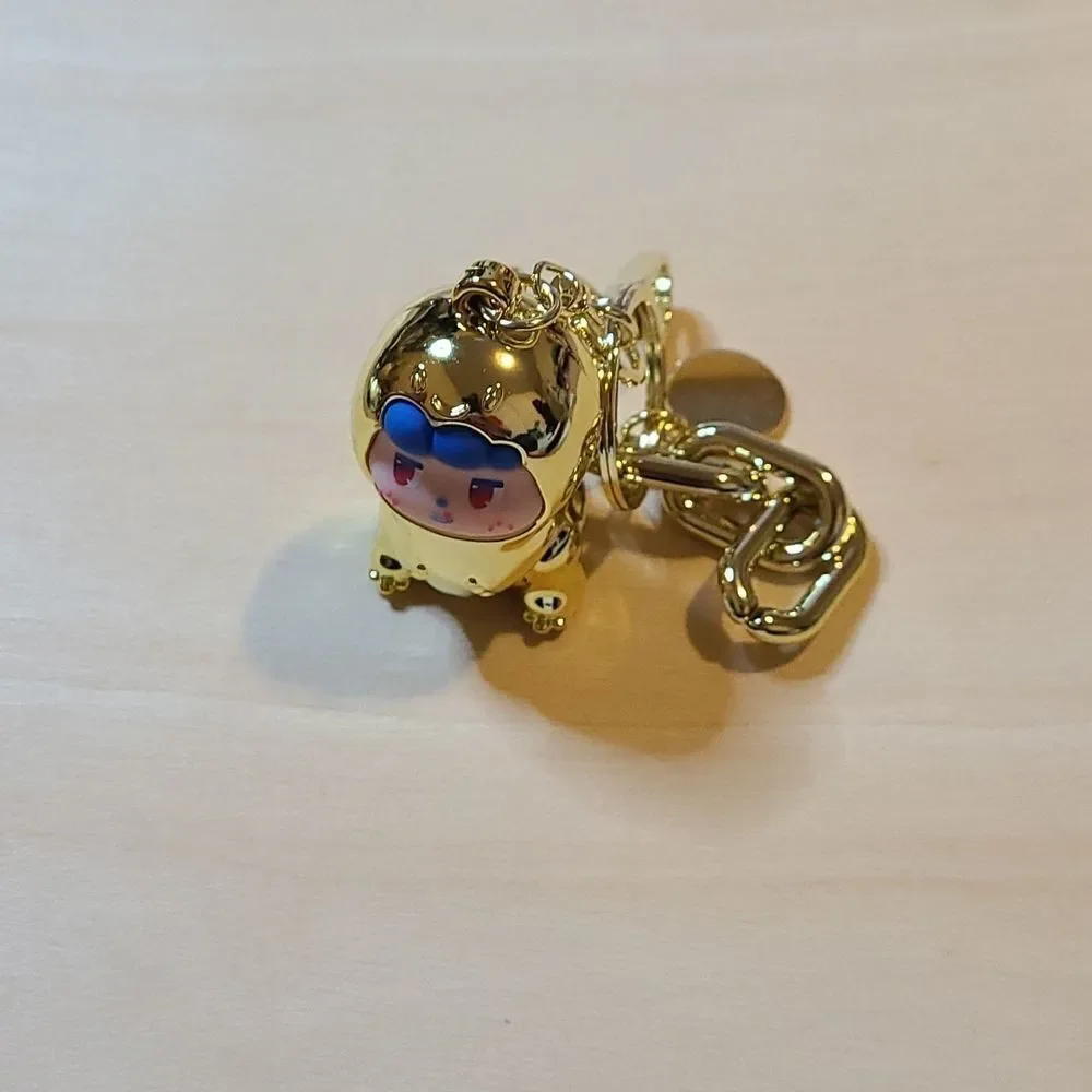 Tyrannosaurus gold pendant keychain